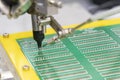 The soldering robot operation with PCB board. Royalty Free Stock Photo