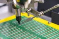 The soldering robot operation with PCB board. Royalty Free Stock Photo