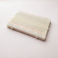 Solderless breadboard isolated on a white background Royalty Free Stock Photo