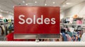 Soldes french text means red sale sign at big box shop in clothing store