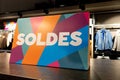 Soldes french text means sale colorful sign in clothing store Royalty Free Stock Photo