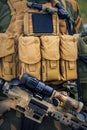 Soldier with an assault rifle wearing a tactical load-carrying vest