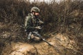 Soldier with binocular investigating the place