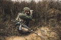 Soldier with binocular investigating the place