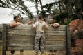 Soldier climbing wooden wall in boot camp Royalty Free Stock Photo