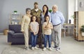 Portrait of happy military veteran and his family standing in the living-room together