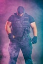 Soldier comes out of the smoke on the battlefield. The concept of military special operations. Posing with knife Royalty Free Stock Photo