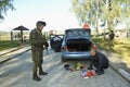 Soldier conducting a search of a stopped car. Checkpoint, training. Novo-Petrivtsi military base, Ukraine