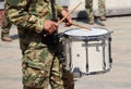 Soldier drummer marching in a row outdoor