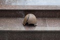 Soldier full of helmets of World War II at monument to the memory of fallen soldiers