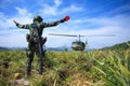 Soldier gives signal to helicopter Royalty Free Stock Photo