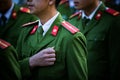 Soldier with green uniform marching in row