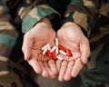 Soldier, hands and drugs from psychologist in therapy or person healing mental health with medication, medicine or pills