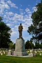 Soldier in heaven - statue in cemetery with memorial veterans independence day flags Royalty Free Stock Photo