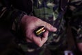 Soldier loading a 9mm caliber cartridge