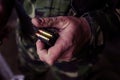 Soldier loading a 9mm caliber cartridge