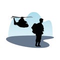 Soldier military standing with helicopter silhouette