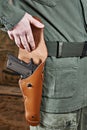 Soldier opens pistol holster