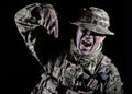 Soldier pointing finger down on black background Royalty Free Stock Photo