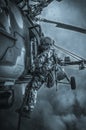 Soldier prepares to jump from a helicopter. The concept of computer games Royalty Free Stock Photo