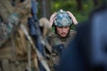 Soldier preparing tactical and commpunication gear for action battle