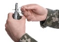 Soldier pulling safety pin out of hand grenade on white background, closeup. Military service Royalty Free Stock Photo