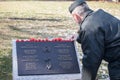 Soldier putting remembrance poppy on the plaque to Nathan Cirillo, victim of the 2014 terrorist shootings on National War memorial