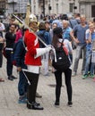 Soldier of Royal Horse Guards in London, surrounded by tourists taking photos.