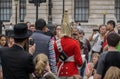 Soldier of Royal Horse Guards in London surrounded by tourists including Hasidic Jewish family in foreground Royalty Free Stock Photo