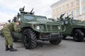 A soldier of the Russian army paints the wheel of an armored car `Tiger`. Preparation for the military parade in honor of the Vict Royalty Free Stock Photo