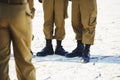 The soldier`s footwear of the Israeli army which is put on legs in clear sunny day