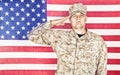 Soldier saluting to national flag of United States Royalty Free Stock Photo