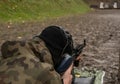 Soldier shooting from a machine gun Royalty Free Stock Photo