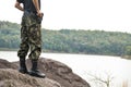 Soldier stand on the rock in nature Royalty Free Stock Photo