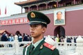 Soldier stands guard in front of Forbidden City in