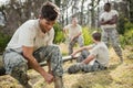 Soldier tying his shoe laces Royalty Free Stock Photo