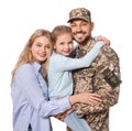 Soldier in Ukrainian military uniform reunited with his family on white background Royalty Free Stock Photo