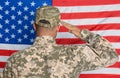 Soldier in uniform against United states of America flag, back view Royalty Free Stock Photo