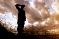 Soldier in uniform saluting . Military service