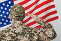 Soldier in uniform and United states of America flag on white background Royalty Free Stock Photo