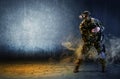 A soldier with virtual reality glasses is holding a pistol in hi Royalty Free Stock Photo