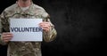 Soldier volunteer mid section against black background