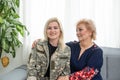 Soldier woman returning home to her family, embracing his mother, close up Royalty Free Stock Photo