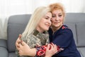 Soldier woman returning home to her family, embracing his mother, close up Royalty Free Stock Photo