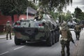 Soldiers and armored vehicles enter the city