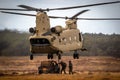 Soldiers attatching a military all-terrain vehicle to a Boeing CH-47F Chinook helicopter. Ginkelse Heide, The Netherlands -