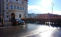 The soldiers of the Austrian army on the guard of honor lead by passing government vehicles. One of the entrances to the Hofburg P