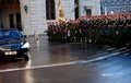 The soldiers of the Austrian army on the guard of honor lead by passing government vehicles. One of the entrances to the Hofburg P