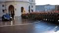 The soldiers of the Austrian army on the guard of honor lead by passing government vehicles. One of the entrances to the Hofburg P