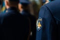 Soldiers in black uniform hold a weapon. Close-up of hands. Chevrons of the troops of the air forces of Russia. Victory Day in Rus